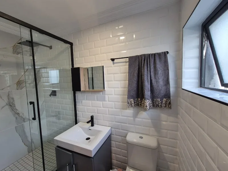 Bathroom renovation with white subway tiles and shower enclosure