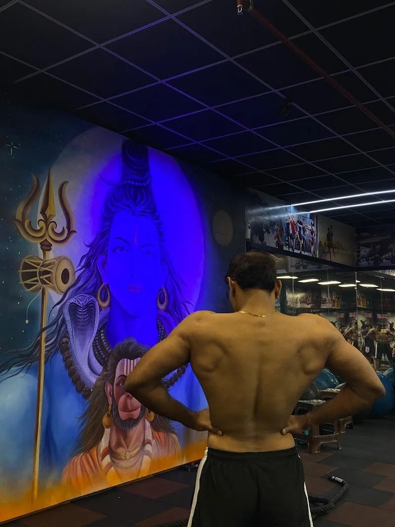 Mahadev Fitness Gym workout area with Mahadev mural